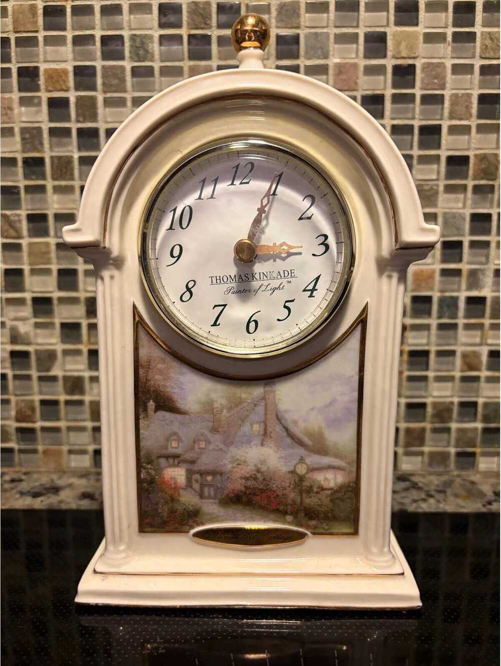This is a 2004 Thomas Kinkade Sweetheart Cottage ceramic mantel clock.